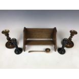 A George V wooden book trough together with a small treen puzzle ball and a pair of ebony