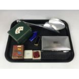 An electroplate cigarette box together with a boxed pocket ashtray, a cigarette lighter and a tooled