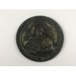 A large 19th Century cast brass medallion commemorating Martin Luther, 10.5 cm