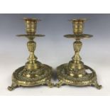 A Victorian pair of brass candlesticks