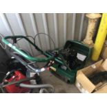 A Suffolk Punch cylinder petrol lawn mower 14S with grass box and 14" scarifier, (serviced March