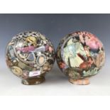 A pair of bubble-included glass globe shades bearing decoupage decoration