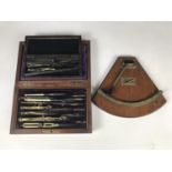 A Victorian mahogany cased drawing instrument set, together with one other smaller example, and a