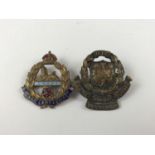 A Sedbergh OTC cap badge and an East Lancashire Regiment sweetheart brooch