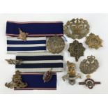 A small quantity of military and other badges and medal ribbons