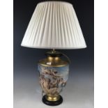 An uncommonly large urn-form table lamp and shade, gilded and decorated with a Neoclassical