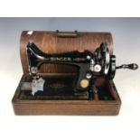 A cased Singer sewing machine, model EC174929