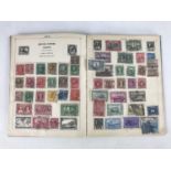 An 'Improved' stamp album with contents