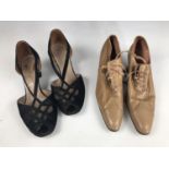 An early 20th Century lady's pair of leather lace up shoes retailed by Au Louvre of Paris,