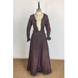 A late Victorian lady's chocolate brown taffeta day dress retailed by Hubter and Grant "Dress and