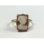 A vintage cameo dress ring, carved as the profile of a young lady, crown set on a 9ct gold shank