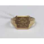 A gentleman's 9ct gold signet ring, having a square face engraved with a monogram, and moulded
