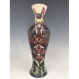 A Moorcroft slender inverted baluster form vase, impressed and painted marks to base, dated 1998, 31