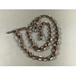 A 9ct rose gold double watch chain, of square-section curb links, with T-bar, swivels and bolt ring,