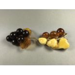 Two Russian amber brooches, each modelled in the form of a fruiting vine on rolled gold boughs
