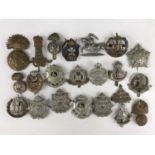 A quantity of British Army cap badges