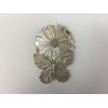 A Michael Serebriany silver pendant brooch modelled in the form of a butterfly poised on the edge of