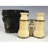 A Victorian cased pair of ivory and gilt metal opera glasses