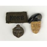 A NAAFI cap badge, Montgomery brooch (a/f), and a KOSB slip-on shoulder title