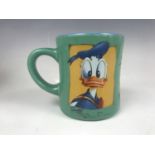 [Autograph] A Disney's "Daffy Duck" china mug signed by child actor Jake Lloyd who played Anakin