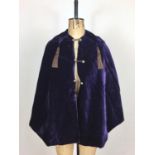 A late Victorian amethyst crushed velvet evening cape, having a pointed collar terminating in