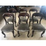 A set of six Victorian mahogany balloon-back dining chairs