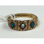 A Victorian turquoise and pearl dress ring, the shaped face being divided into three cells and