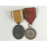 A German Third Reich West Wall medal and an Anschluss medal