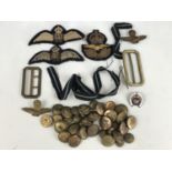 A related group of Second World War RAF officer's insignia including pilots' wings, cap badges etc