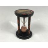 A Mauchline Tartan Ware egg timer, bearing a view of "High St, Grantown", 7.5 cm