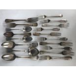 A large quantity of late Georgian and early Victorian silver cutlery, of fiddle pattern and thread
