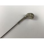 An Edwardian silver novelty hat pin modelled as a golf club, marks rubbed, Birmingham, 1907, 4.8g