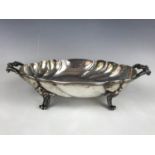 A continental white-metal footed dish, of cusped and writhen oval form, with flanking handles and