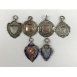 Six George V and later silver prize fob medallions, predominantly for football, 63.5g