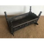 A 17th Century and later carved oak rocking cradle