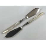 A pair of Edwardian silver butter knives, having mother of pearl handles, Henry Williamson Ltd,