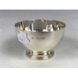 A small silver bowl, of circular section with moulded foot, Mappin & Webb, 1966, 7.5 cm x 4 cm high,