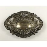 A Victorian silver trinket dish, of cusped lenticular section, having moulded and reticulated