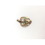 An Edwardian 9ct rose gold and turquoise openwork heart shaped pendant, centrally set with a