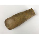 A Neolithic flint axe head, 13 cm