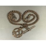 An Edwardian gentleman's 9ct rose gold curb-link double "Albert" watch chain with swivels, T-bar and