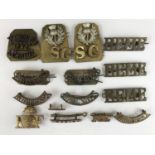 A quantity of brass shoulder titles