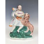 A 19th Century Staffordshire flatback modelled as Samson and the lion, 27 cm