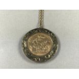A 1903 gold sovereign, held in a 9ct gold engraved pendant mount, on a yellow-metal neck chain,