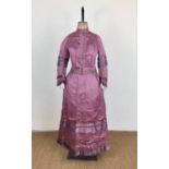 A Victorian lady's mauve grosgrain silk day dress, of two-piece construction, the boned bodice