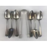 A George III set of six Old English pattern silver teaspoons and sugar tongs, each bearing the