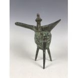 An archaic style Chinese bronze lamp / vessel