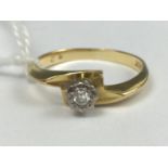 A modern diamond solitaire ring, the brilliant-cut stone of approximately .10ct, crown and