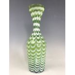 A Nailsea type green and milk glass vase, having pronounced waisted neck, 31 cm