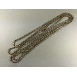 A late 19th Century yellow-metal guard chain, stamped 9ct, 26.7g